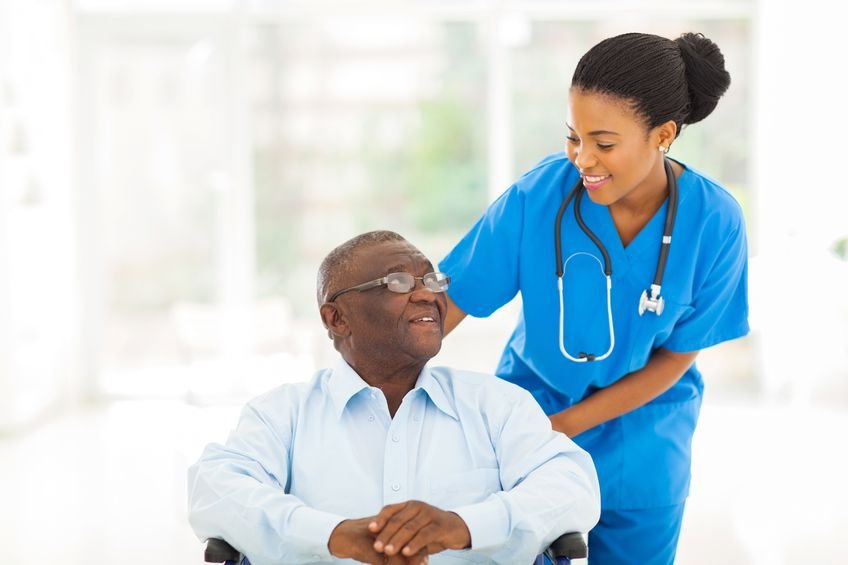 Caregiver helping an elderly individual stay active